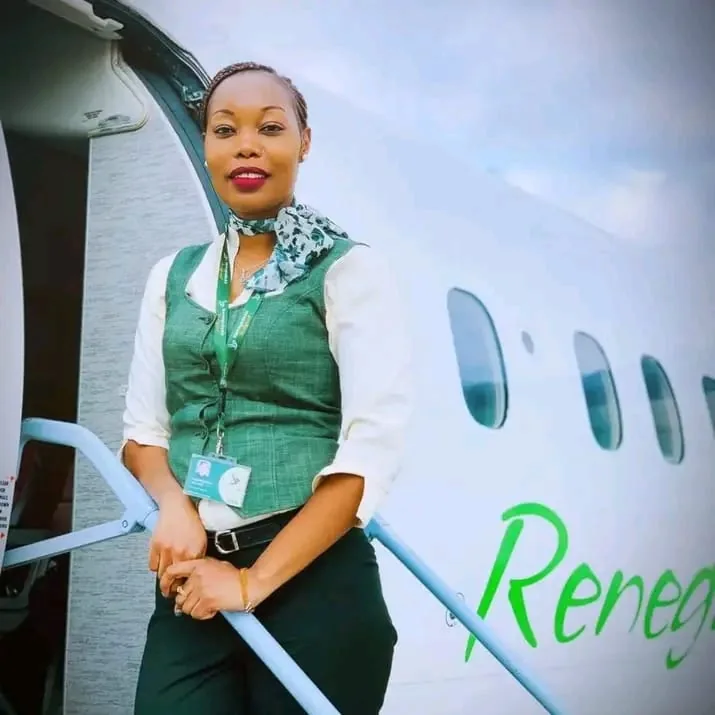 Renegade Air cabin crew member welcoming passengers at the aircraft door