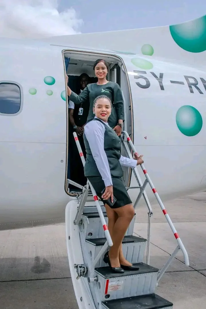 Renegade Air crew welcoming charter guests at the aircraft airstairs