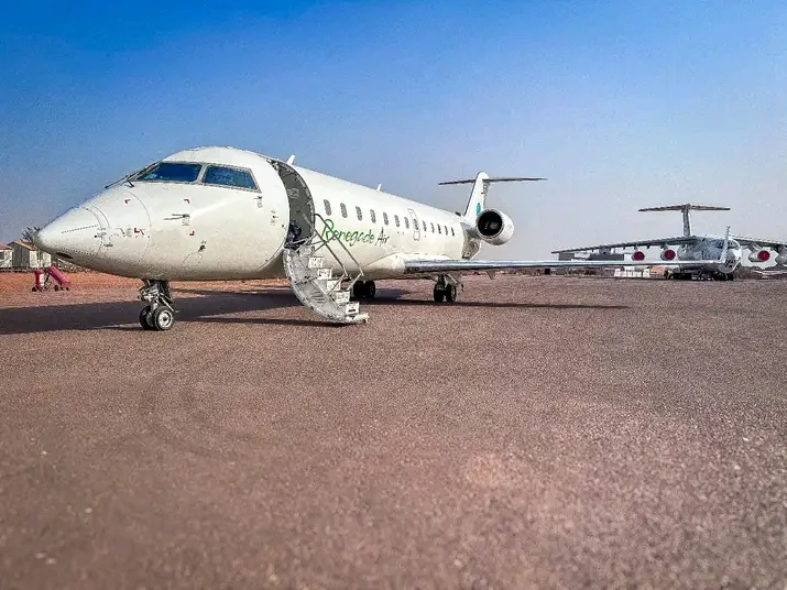 Renegade Air regional jet parked on the airport apron